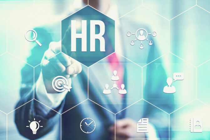 Stylized drawing of human resources symbols on a glass board.