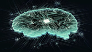 Stylized image of a human brain in the form of a microchip showing a processor and connections.