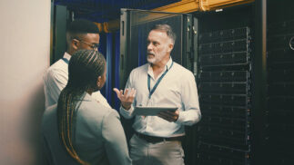 Cybersecurity professionals in a server room.